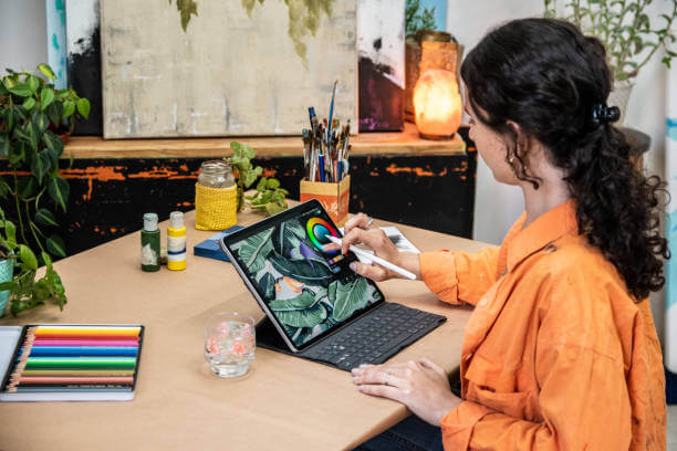A woman who making a canva design on laptop 